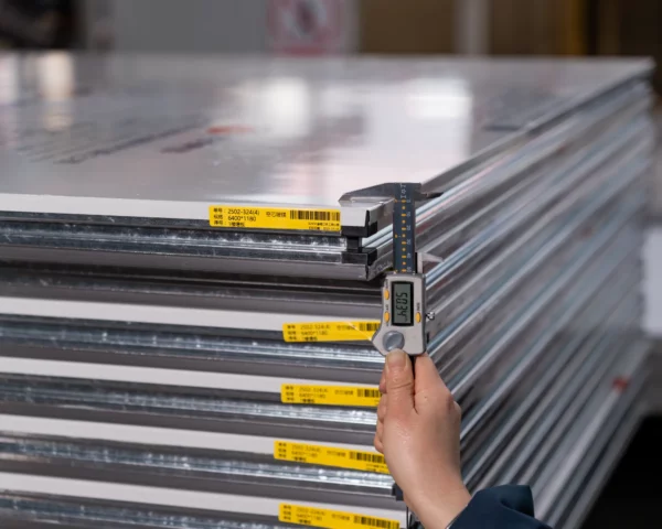 Yaguan technicians measuring the wall panel dimensions